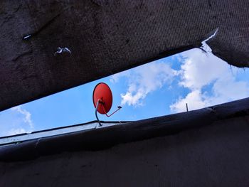 Low angle view of building against cloudy sky