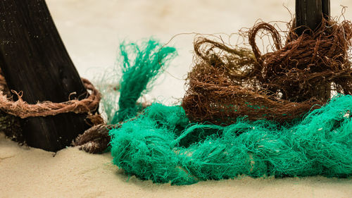 Close-up of fishing net on wooden table