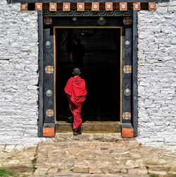 Rear view of a woman standing outdoors