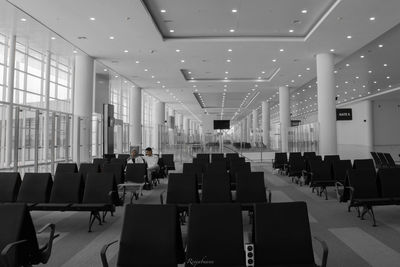 Empty chairs and tables in airport