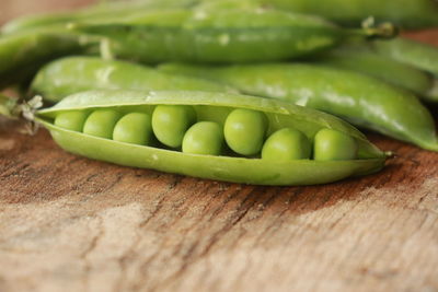 Close-up of green chili peppers on cutting board