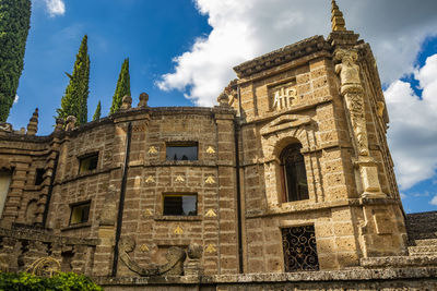 Low angle view of old building against sky