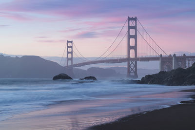 View of suspension bridge over sea