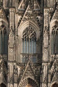 Vertical shot of the facade of the cologne cathedral with decoration and ornaments, cologne, germany