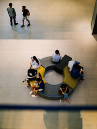 High angle view of people enjoying on floor