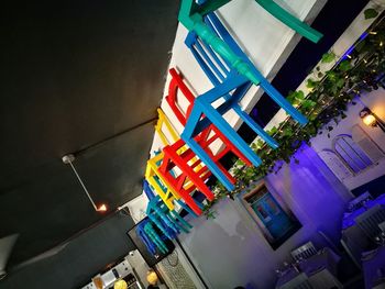 High angle view of illuminated buildings against sky at night