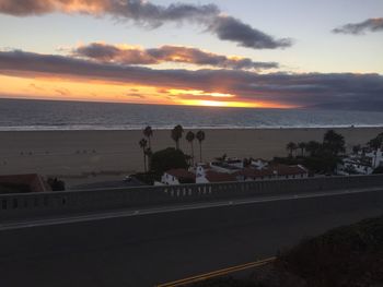 Scenic view of road against sky during sunset