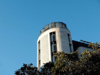 Low angle view of building against clear blue sky