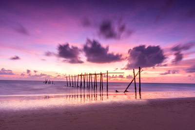 Scenic view of beach against sky during sunset