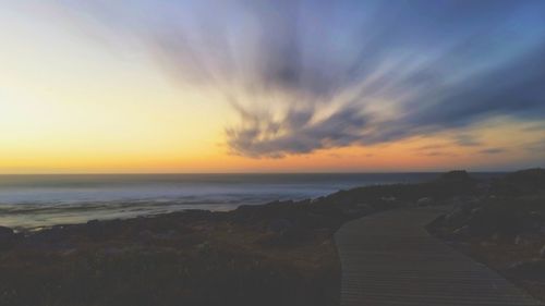 Scenic view of sea at sunset