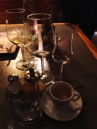 Close-up of wine glasses on table