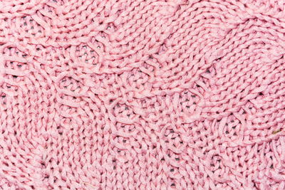 Full frame shot of pink knitted fabric