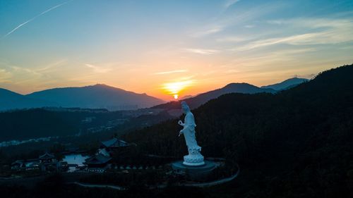 Scenic view of mountains against sky during sunset