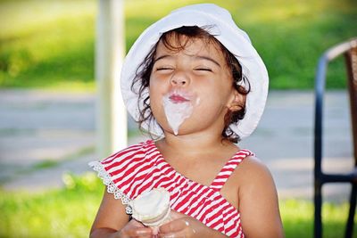Close-up of cute girl eating ice cream