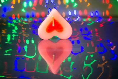 Close-up of illuminated heart shape in swimming pool