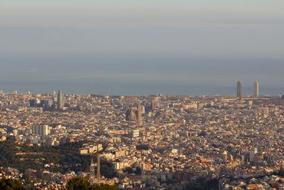 High angle view of city buildings against sky