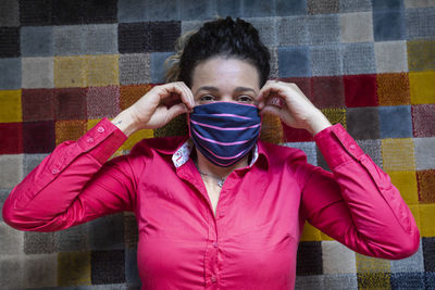 Portrait of happy man with pink umbrella