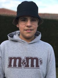 Portrait of young man wearing eyeglasses standing outdoors