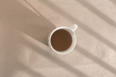 High angle view of coffee cup on table