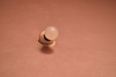 High angle view of light bulb on table