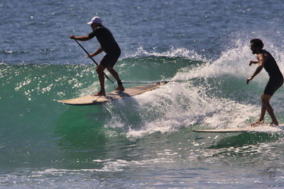 Full length of man surfing in sea