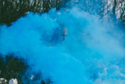 Man in blue smoke