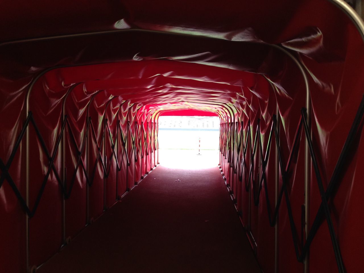 ILLUMINATED RED LIGHT IN CORRIDOR