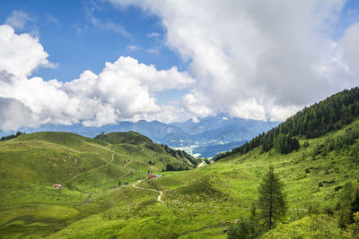 Scenic view of green landscape against sky