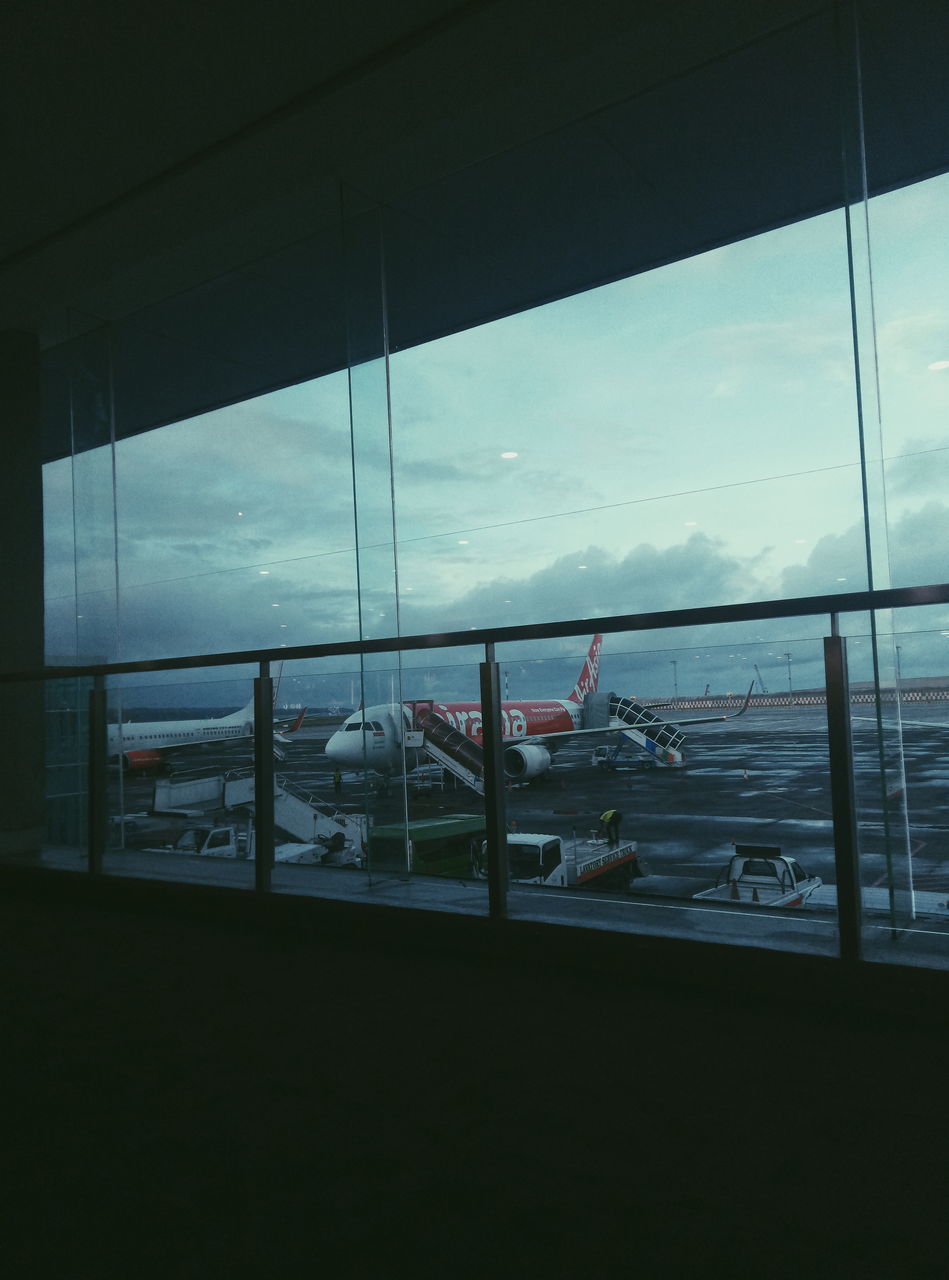 sky, sea, reflection, water, window, transportation, light, glass, mode of transportation, blue, nature, architecture, cloud, ship, nautical vessel, built structure, no people, day, transparent, travel, interior design, outdoors, window covering, railing, scenics - nature, airport, horizon