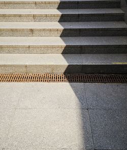 High angle view of shadow on footpath