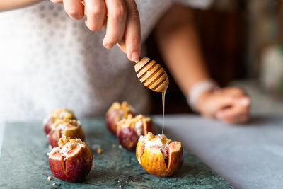 Midsection of person preparing food on table