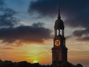 Clock tower against sky during sunset