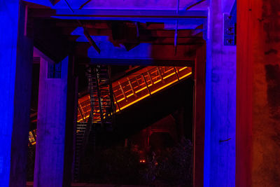 Illuminated entrance of building at night