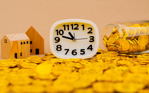 Close-up of clock on table