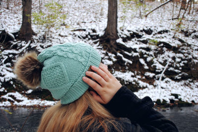 Midsection of woman in park during winter