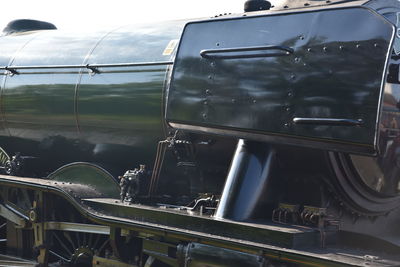 Close-up of train against sky