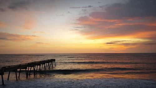 Scenic view of sea against sky at sunset