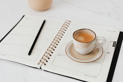 High angle view of coffee cup on table