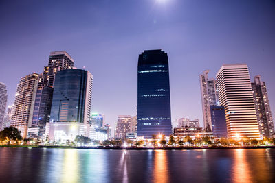 Low angle view of skyscrapers lit up at night