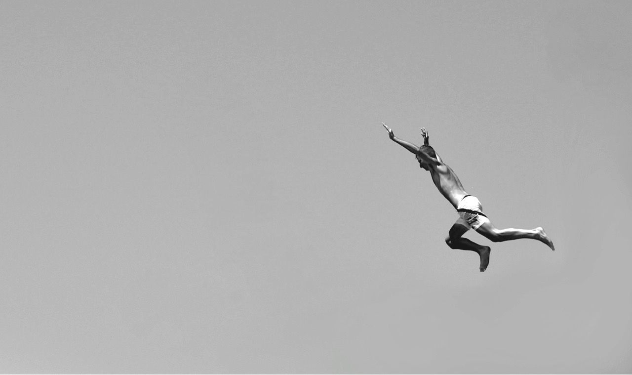 copy space, flying, mid-air, low angle view, clear sky, airplane, air vehicle, motion, full length, skill, spread wings, outdoors, sky, silhouette, transportation, day, freedom, on the move, no people, nature