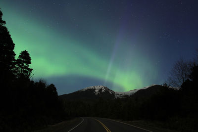 Scenic view of road against sky at night