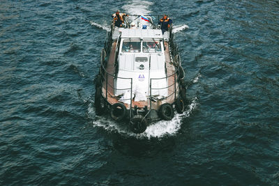 High angle view of people sailing on sea