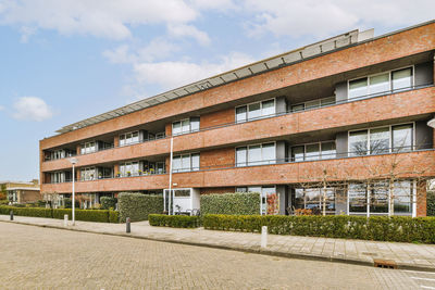 Buildings in city against sky