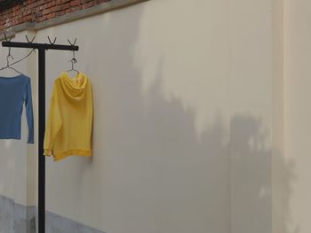 Low angle view of clothes hanging on wall