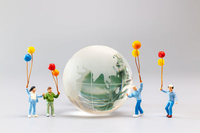 High angle view of figurines on white background