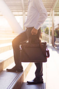 Low section of man standing on floor