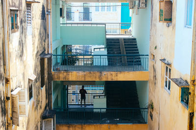 High angle view of man standing in apartment