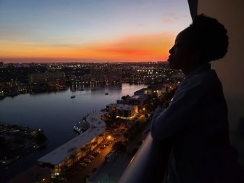 High angle view of city at sunset