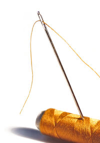 Close-up of light bulbs on table against white background