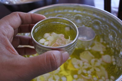 Cropped image of person holding food